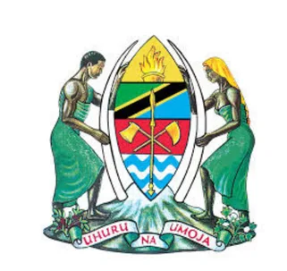 ESS Utumishi logo featuring the Tanzanian government emblem, which includes a crossed axe and hoe, symbolizing labor and freedom. The national flag is held by two figures standing beside a shield, with the motto 'Uhuru na Umoja' at the base, representing liberty and unity.
